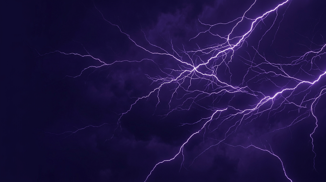 Branching purple lightning across a dark sky