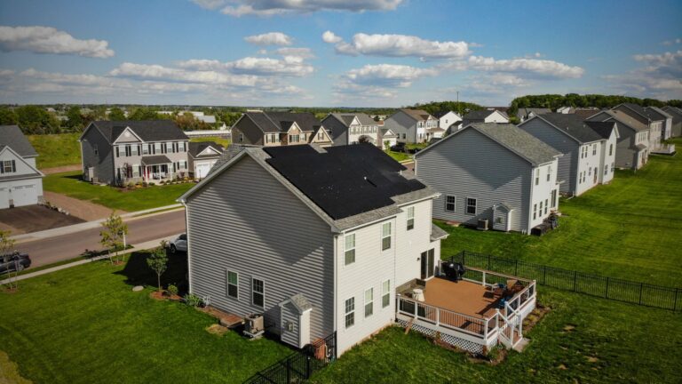 Solar panels on the roof of a suburban area.