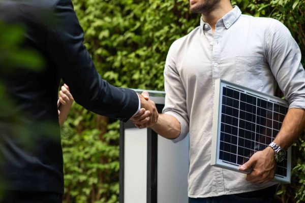 Electrical Engineer Technician and CEO executive business people making handshake after meeting. clean and green alternative energy concept.